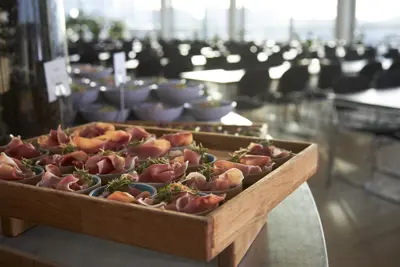 Buffet with dishes and a view of the seating area