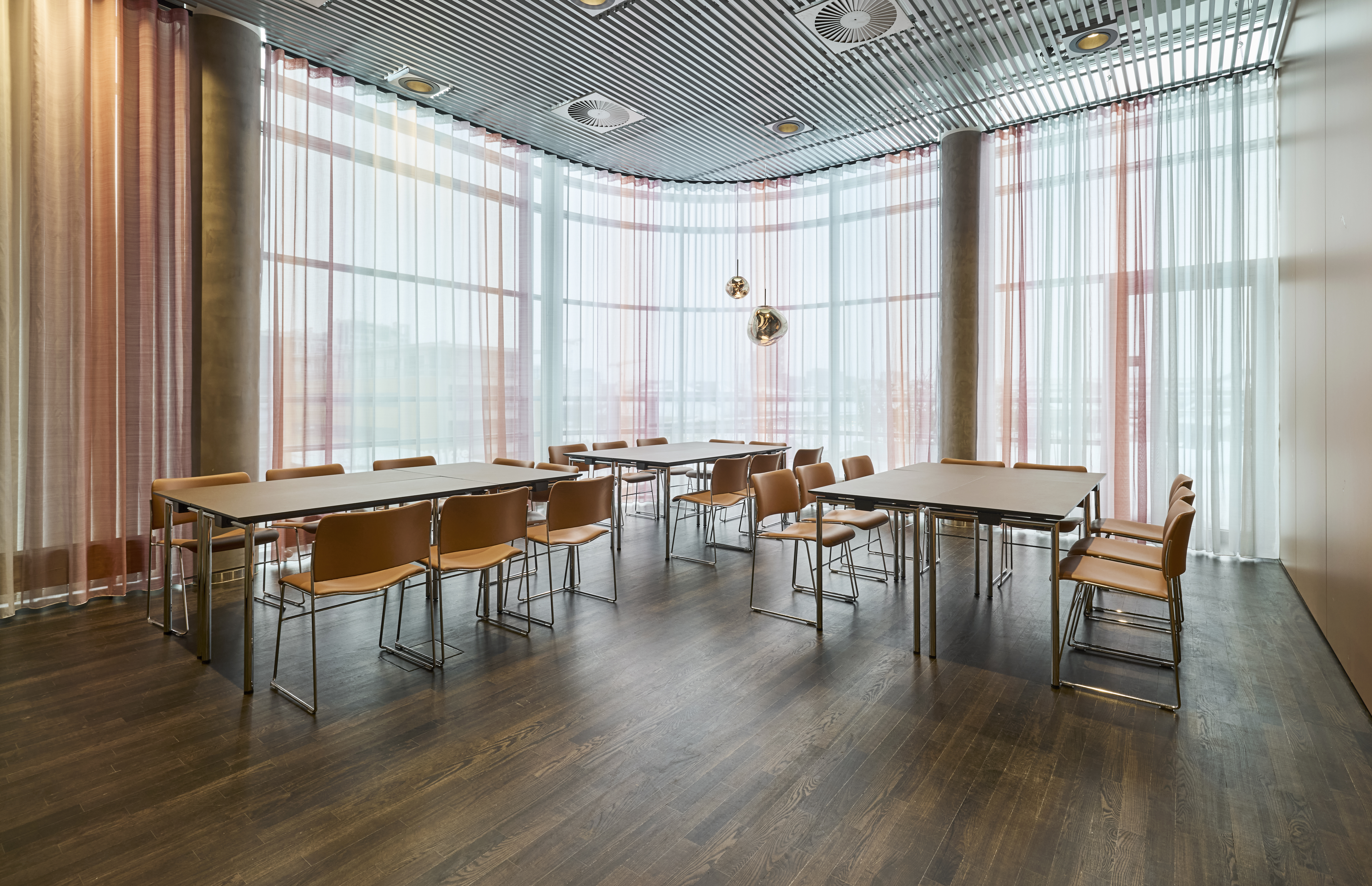 A bright meeting room with a table setup 