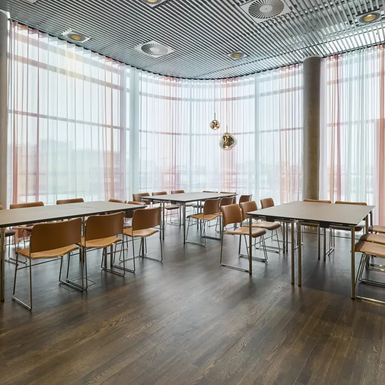 A bright meeting room with a table setup