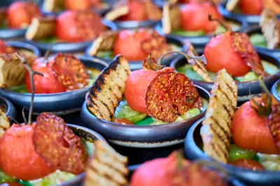 Lots of plates with roasted tomatoes