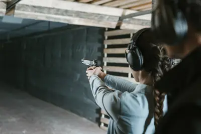 A shooter getting ready to fire a pistol in DGI Byen
